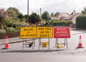 picture of road signs with words "no cpc = no drivers" and "are you up to date?" and "road ahead closed"
